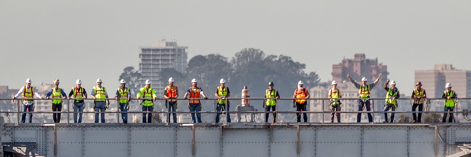 workers on a bridge in safety gear